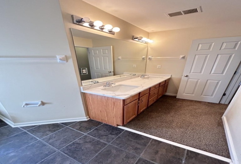 Bathroom with vanity and tile patterned floors