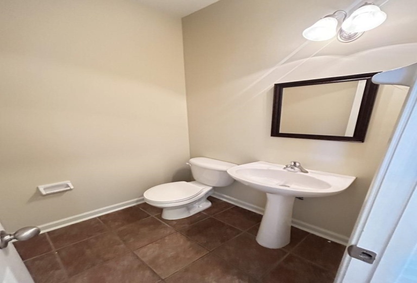 Bathroom featuring tile patterned flooring and toilet