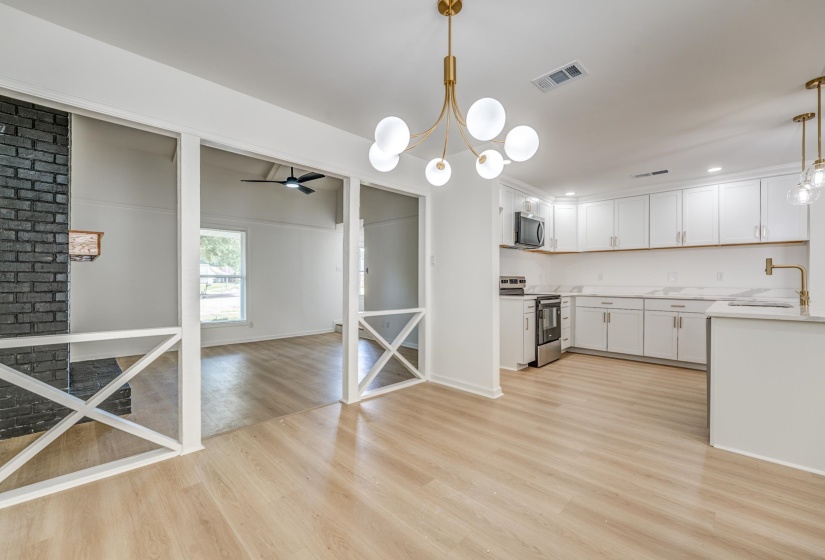 Open-concept living space with wood-finish flooring