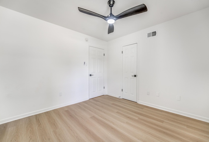 Room featuring light wood-finish flooring and white walls