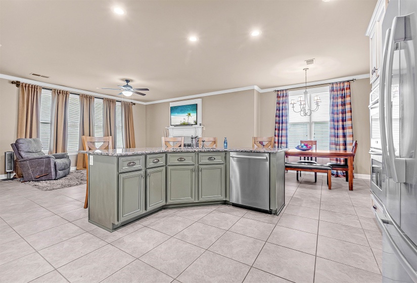Kitchen island with granite countertop and integrated stainless steel dishwasher