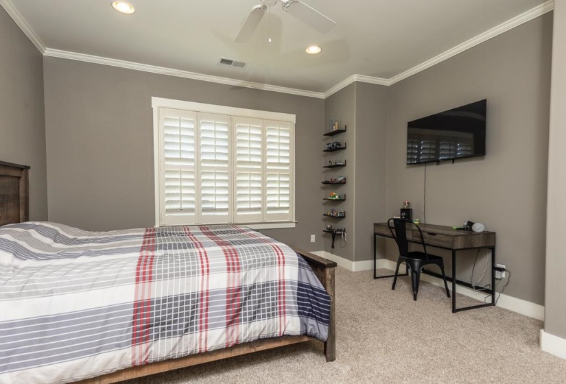 Neutral tone wall paint with white crown molding