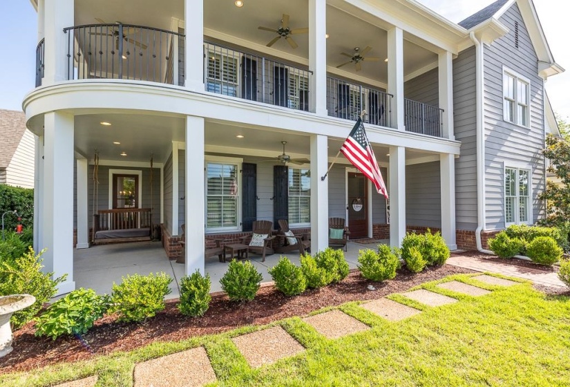 Two-story exterior with horizontal siding and a prominent front porch