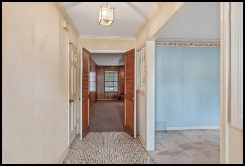 View from Entry past the Living/Dining Rooms to the Spacious Den.