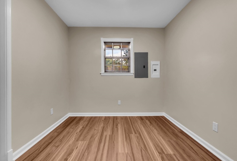 Neutral-toned walls complement wood-finish flooring