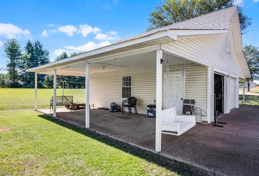 View of patio / terrace featuring a garage