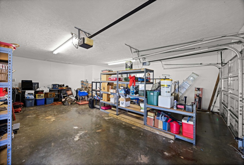Garage featuring a garage door opener