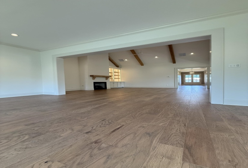 Wide plank wood-finish flooring throughout