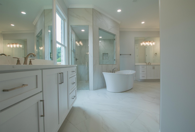 Bathroom featuring vanity, tile patterned flooring, tile walls, and a chandelier