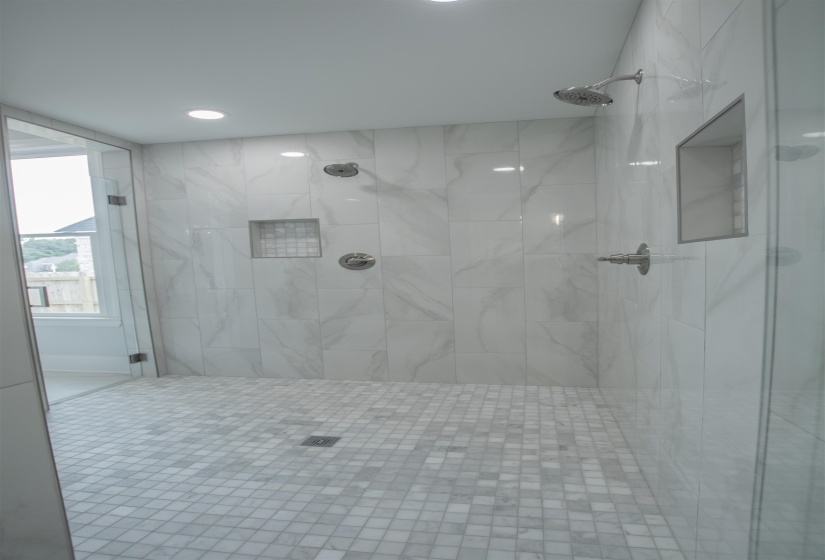Bathroom featuring tiled shower