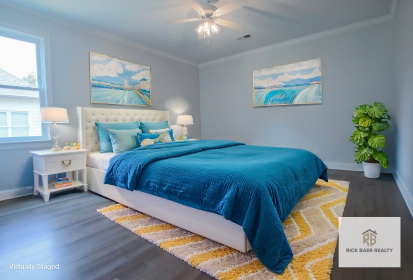 Bedroom with wood finished floors, baseboards, crown molding, and a ceiling fan