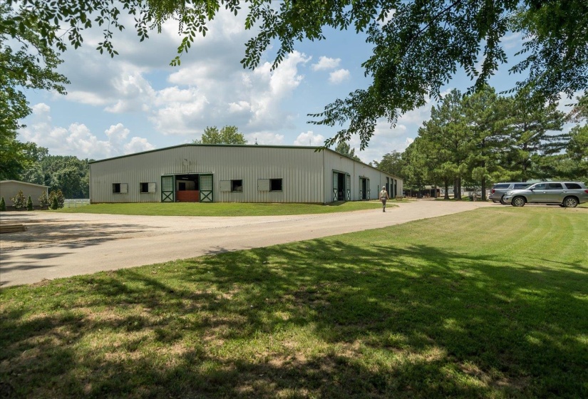 View of side of property with a lawn