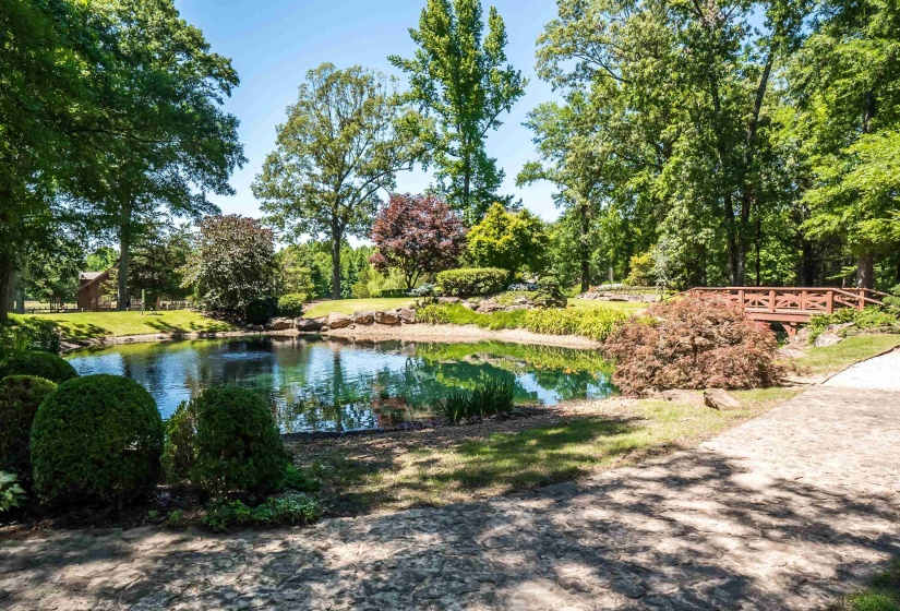 View of pond and foot bridge