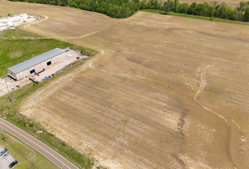 Birds eye view of property with a rural view