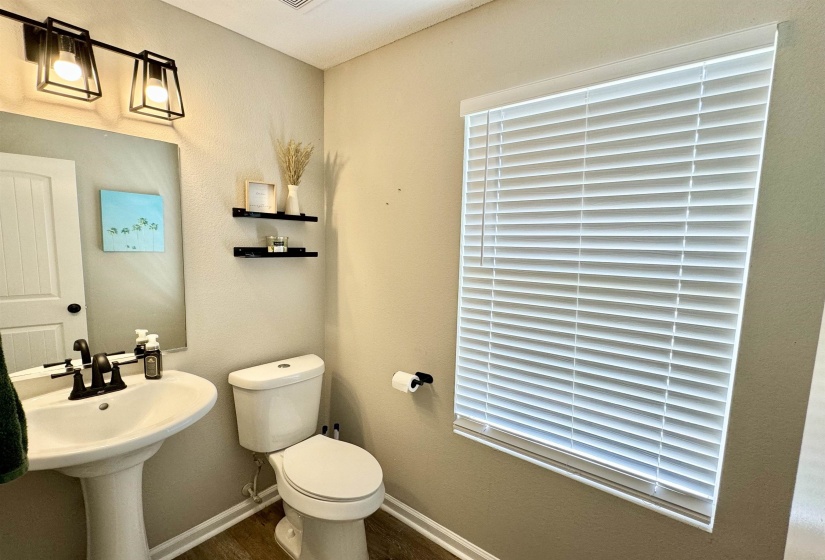 Bathroom with toilet and hardwood / wood-style flooring