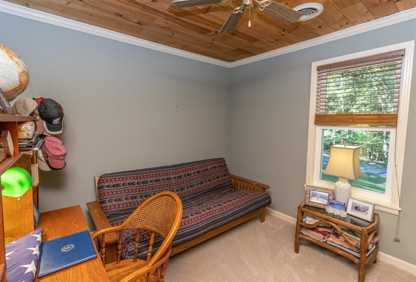 Sitting room featuring ceiling fan, carpet, ornamental molding, and wooden ceiling