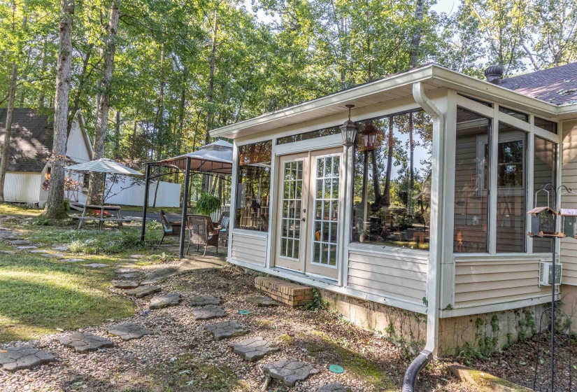 View of property exterior featuring a gazebo