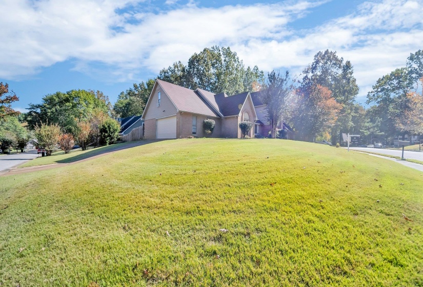 Front facade featuring a front lawn and a garage