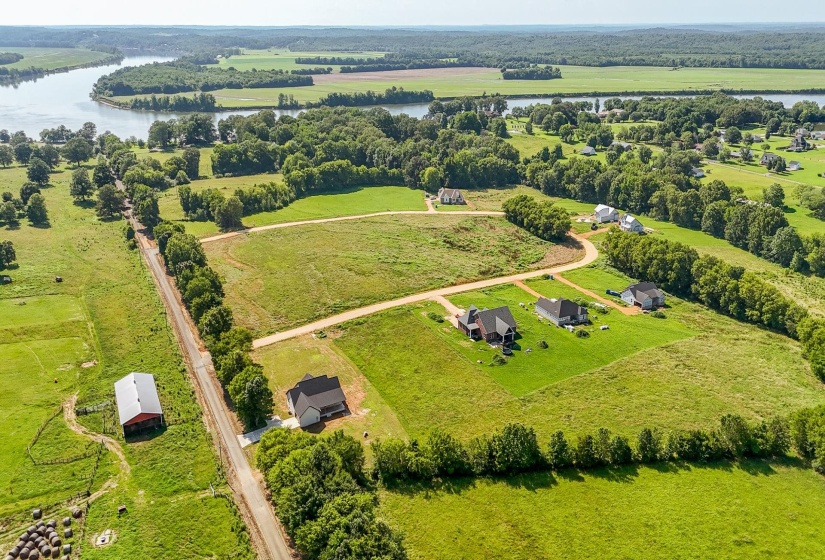 Aerial view of sparsely populated area with a nearby body of water