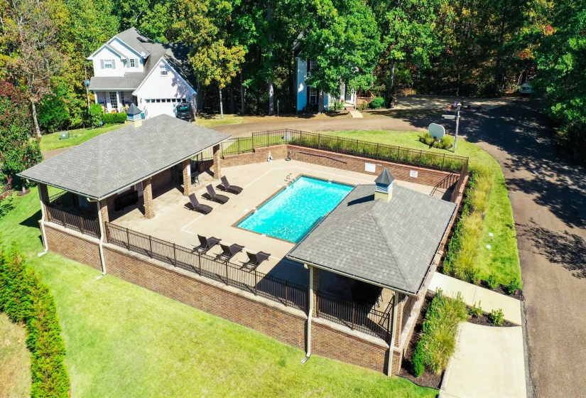 View of swimming pool with a lawn and a patio