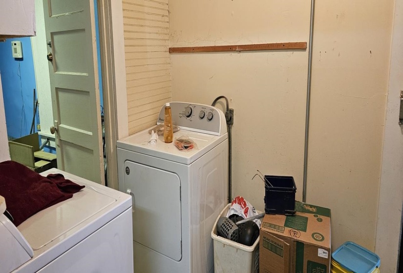 Laundry room featuring washing machine and clothes dryer