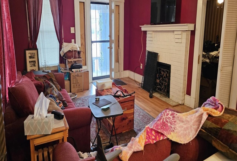 Living room featuring a fireplace and light hardwood / wood-style floors