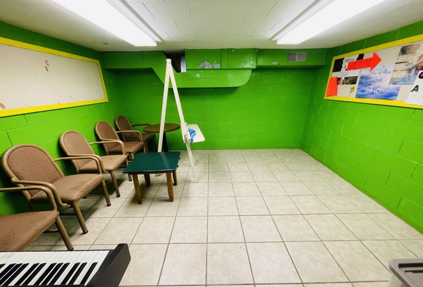 Basement featuring light tile patterned floors