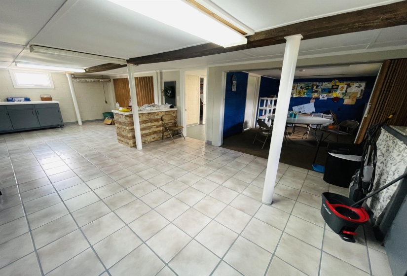 Basement featuring tile patterned flooring