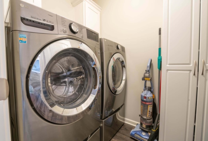Laundry area featuring separate washer and dryer and dark hardwood / wood-style floors