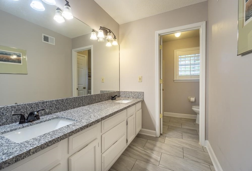 Granite countertops in the bath.
