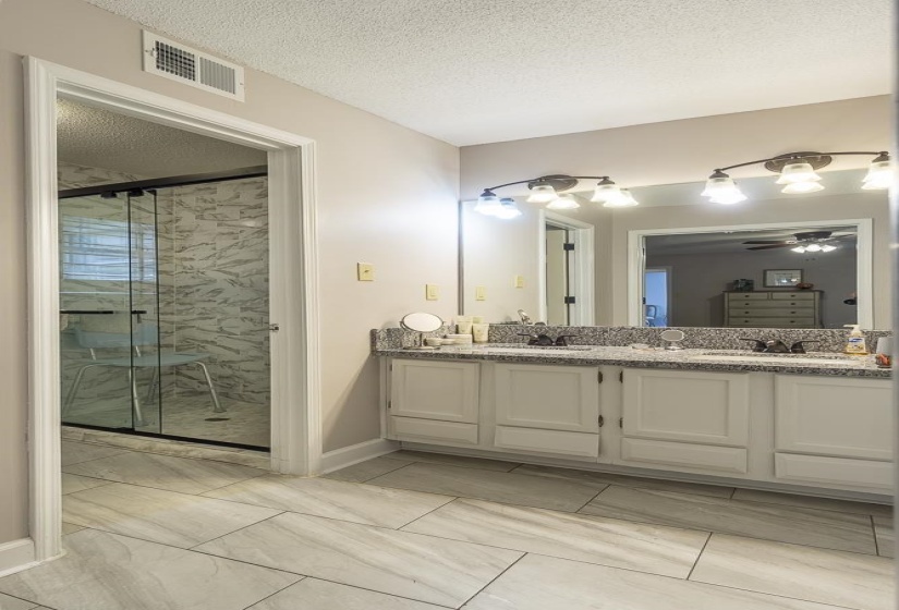 Primary Bath has granite counter with double vanity, and Large shower