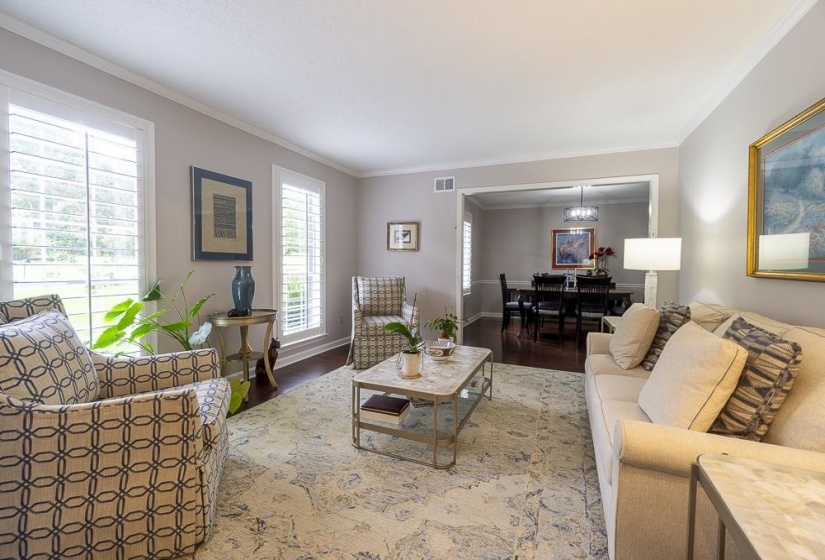Living room featuring Crown molding and hardwood flooring