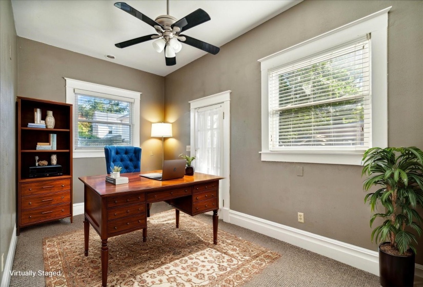 Office space with carpet flooring and ceiling fan
