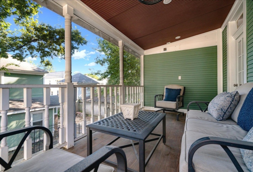 View of patio featuring an outdoor living space and a balcony