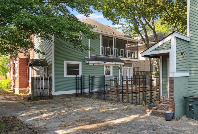 Rear view of property featuring a sunroom