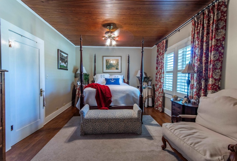 Bedroom featuring crown molding, wood ceiling, ceiling fan, and hardwood / wood-style flooring
