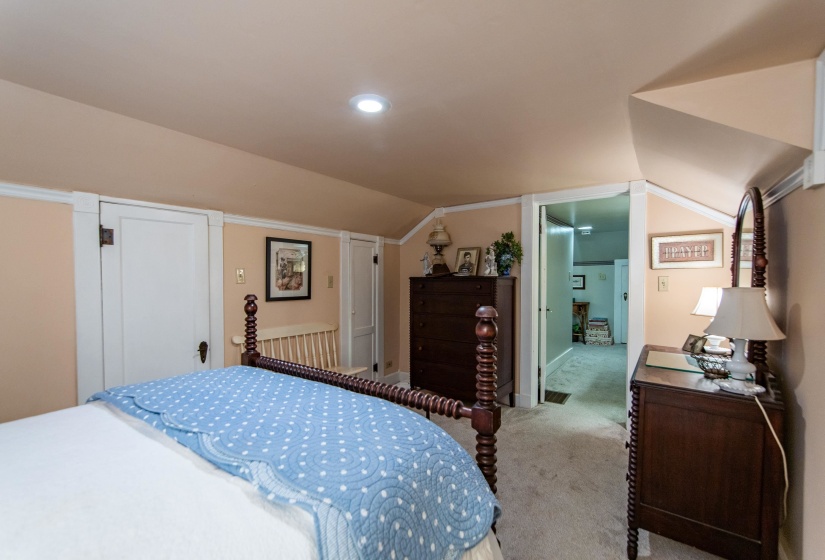 Carpeted bedroom with vaulted ceiling