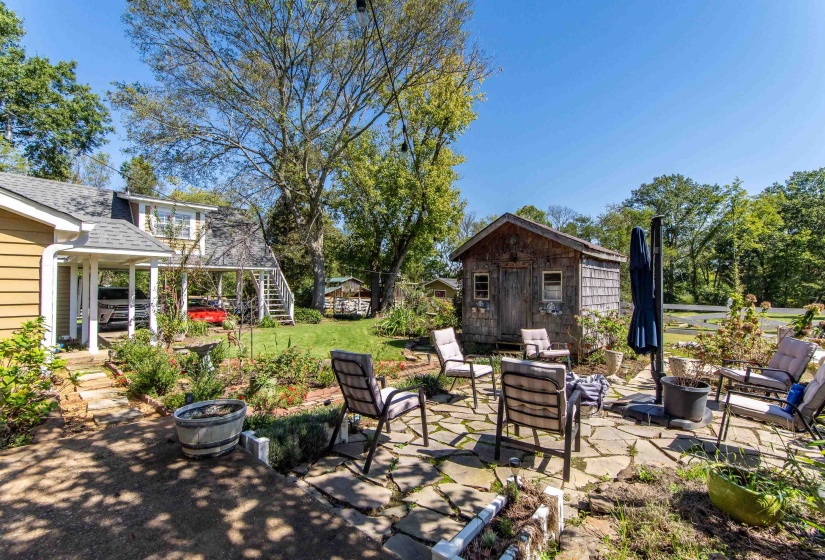 View of patio / terrace with outdoor lounge area and an outbuilding