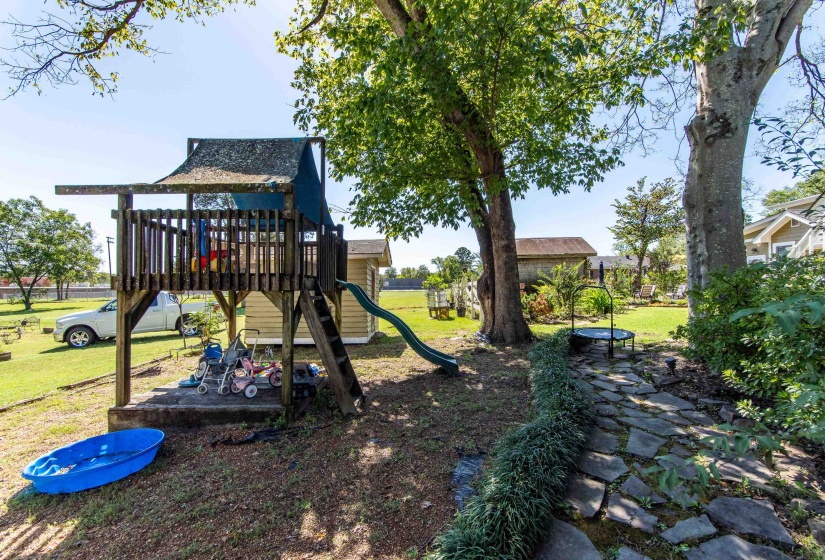 View of play area with a lawn