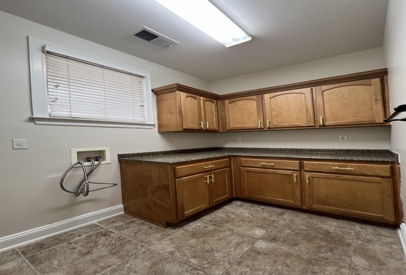 Kitchen with dark tile patterned flooring