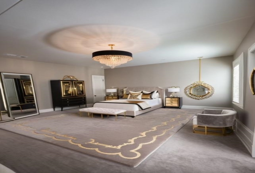 Bedroom with a chandelier and carpet floors