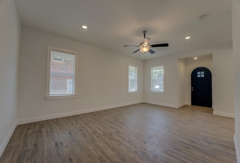 Unfurnished room featuring ceiling fan and wood-type flooring