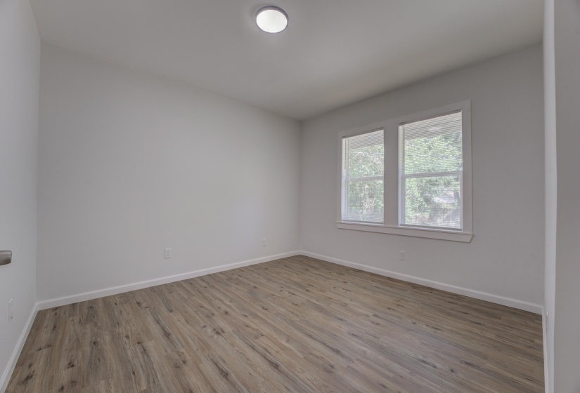 Spare room with hardwood / wood-style floors