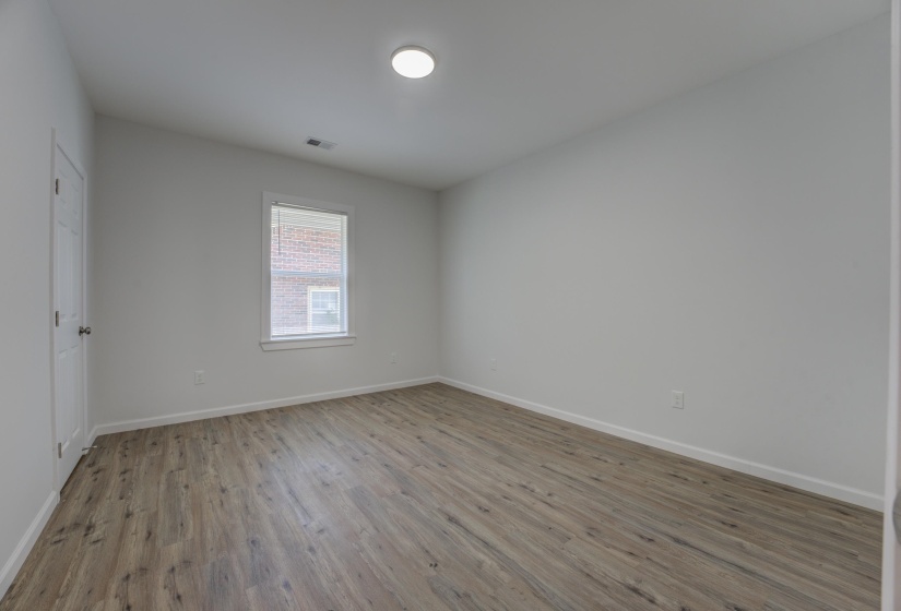 Unfurnished room with hardwood / wood-style flooring