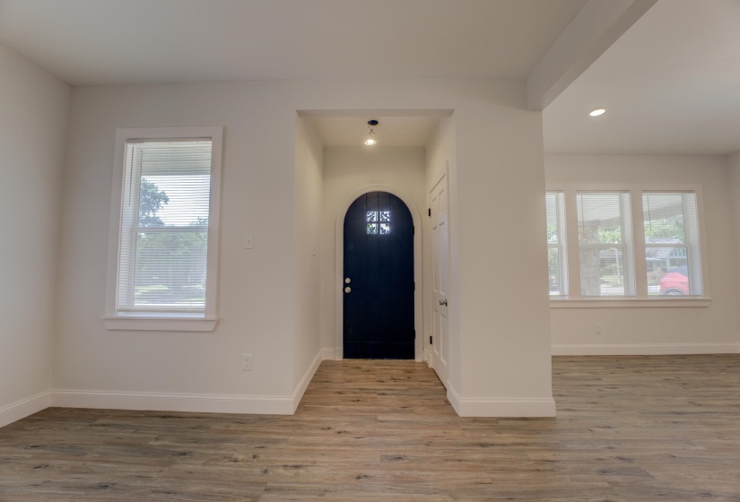 Foyer featuring hardwood / wood-style flooring and a healthy amount of sunlight