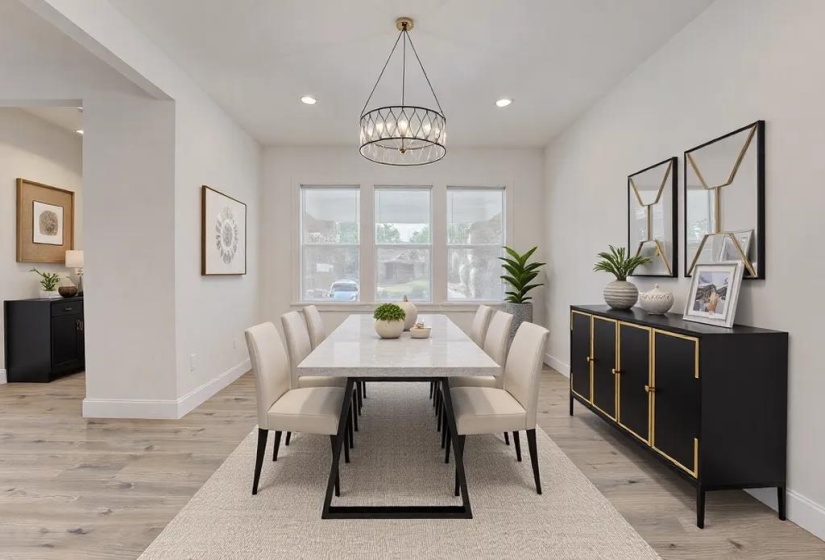 Dining area with light hardwood / wood-style floors and a notable chandelier