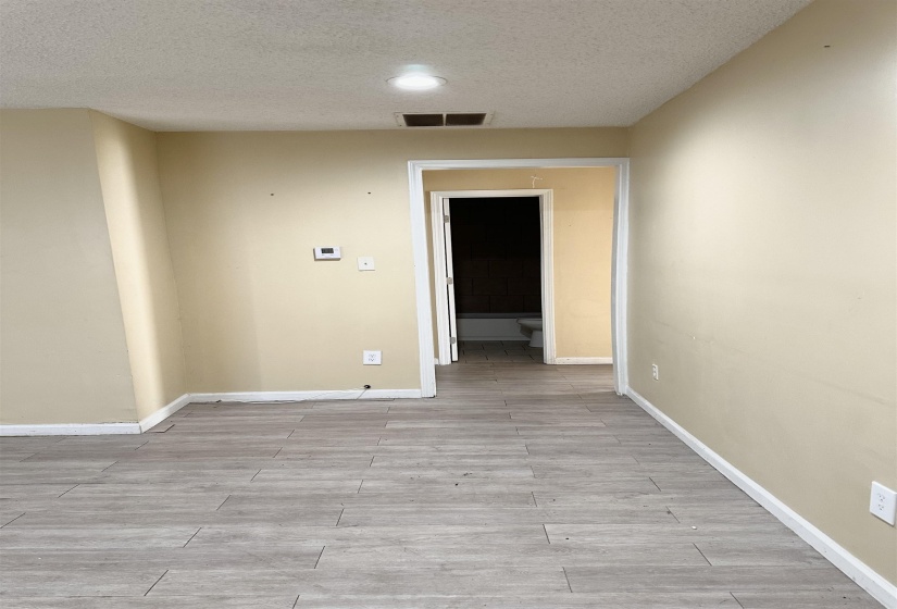 Unfurnished room featuring a textured ceiling