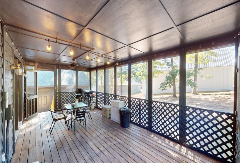 Unfurnished sunroom featuring a water view