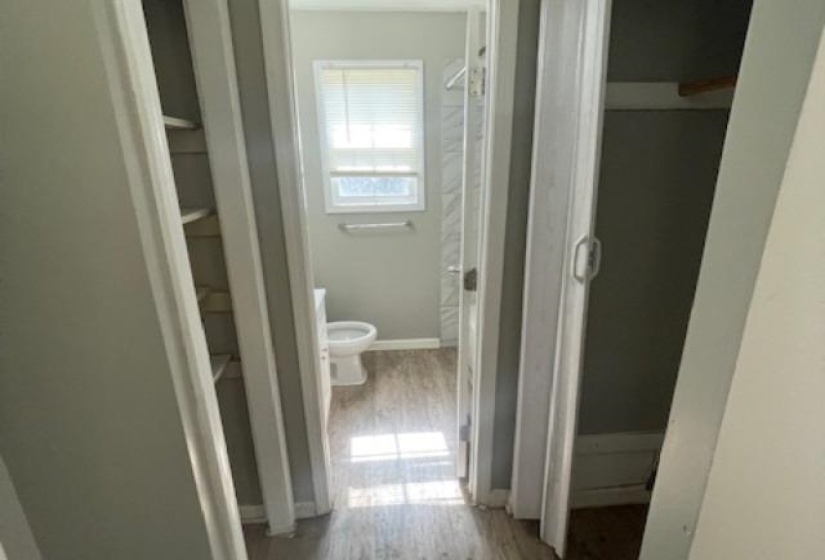 Hallway with wood-type flooring