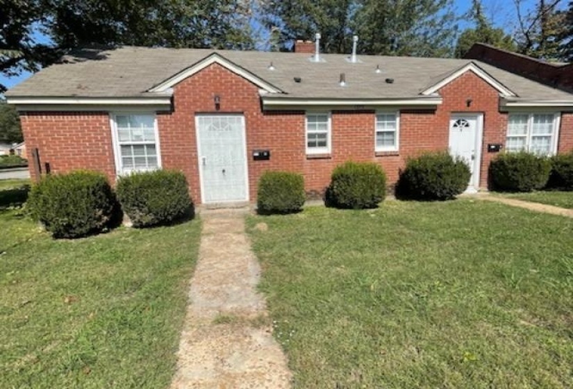Bungalow-style house featuring a front lawn